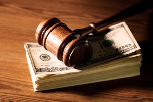gavel and stack of money on the desk of a Clinton Township child support lawyer