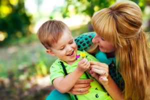 mother and son laughing and having together representing how our Sterling Heights child custody lawyers understand that child custody is tough and emotional