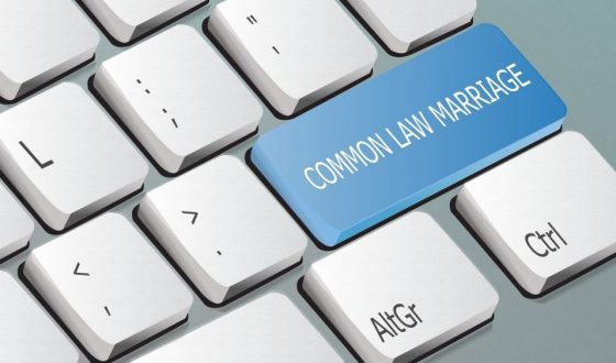 Common Law marriage concept on keyboard, for help with cohabitation agreement call our Family Law Attorney Clinton Township.