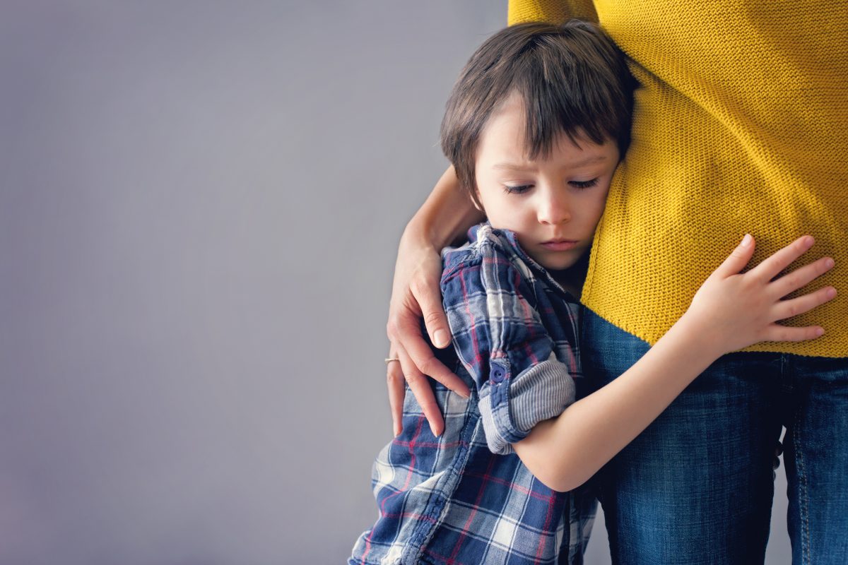 Son hugging his mom, the family law attorneyes Royal Oak can help with family law needs.